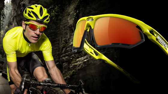 Rudy Project sports glasses for cycling with orange mirrored lenses and a yellow-black frame
